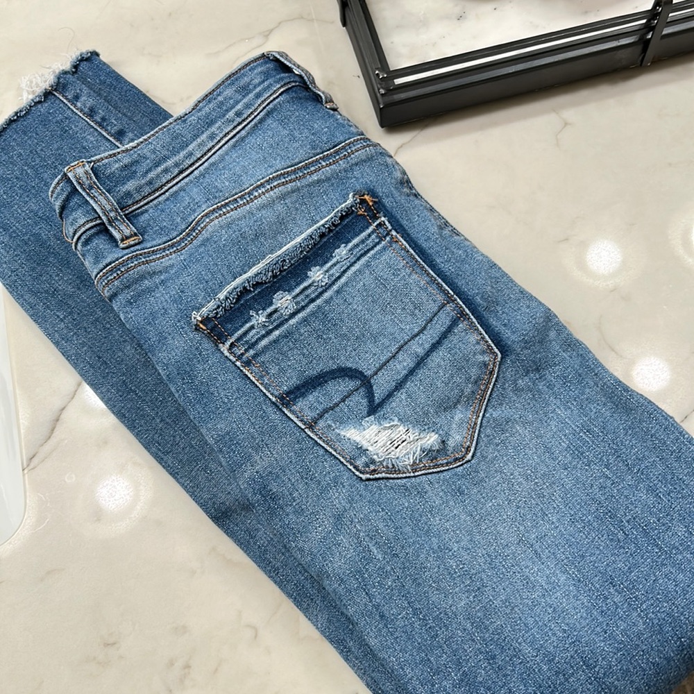 American eagle super stretch high waisted ripped jeans.